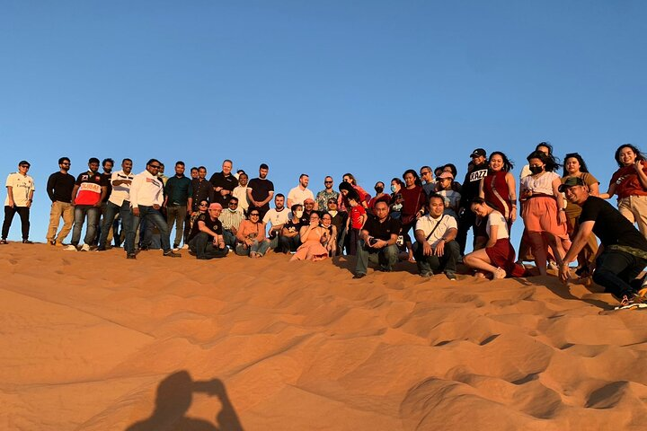 Gather with fellow adventurers in the stunning desert landscape sharing memorable moments while exploring the unique charm of Dubai’s red dunes and diverse activities. Enjoy camaraderie and excitement!